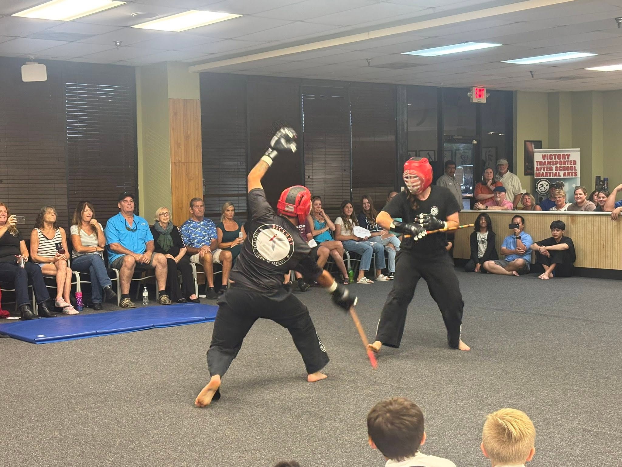 Sensei Cory practices stick sparring during Kali training.