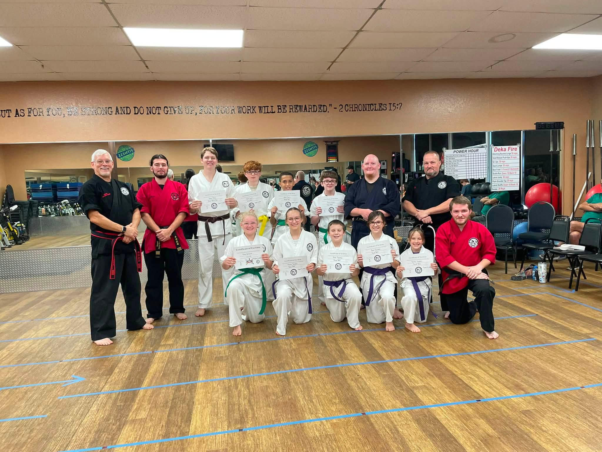Students and instructors gather to celebrate a night of testing.