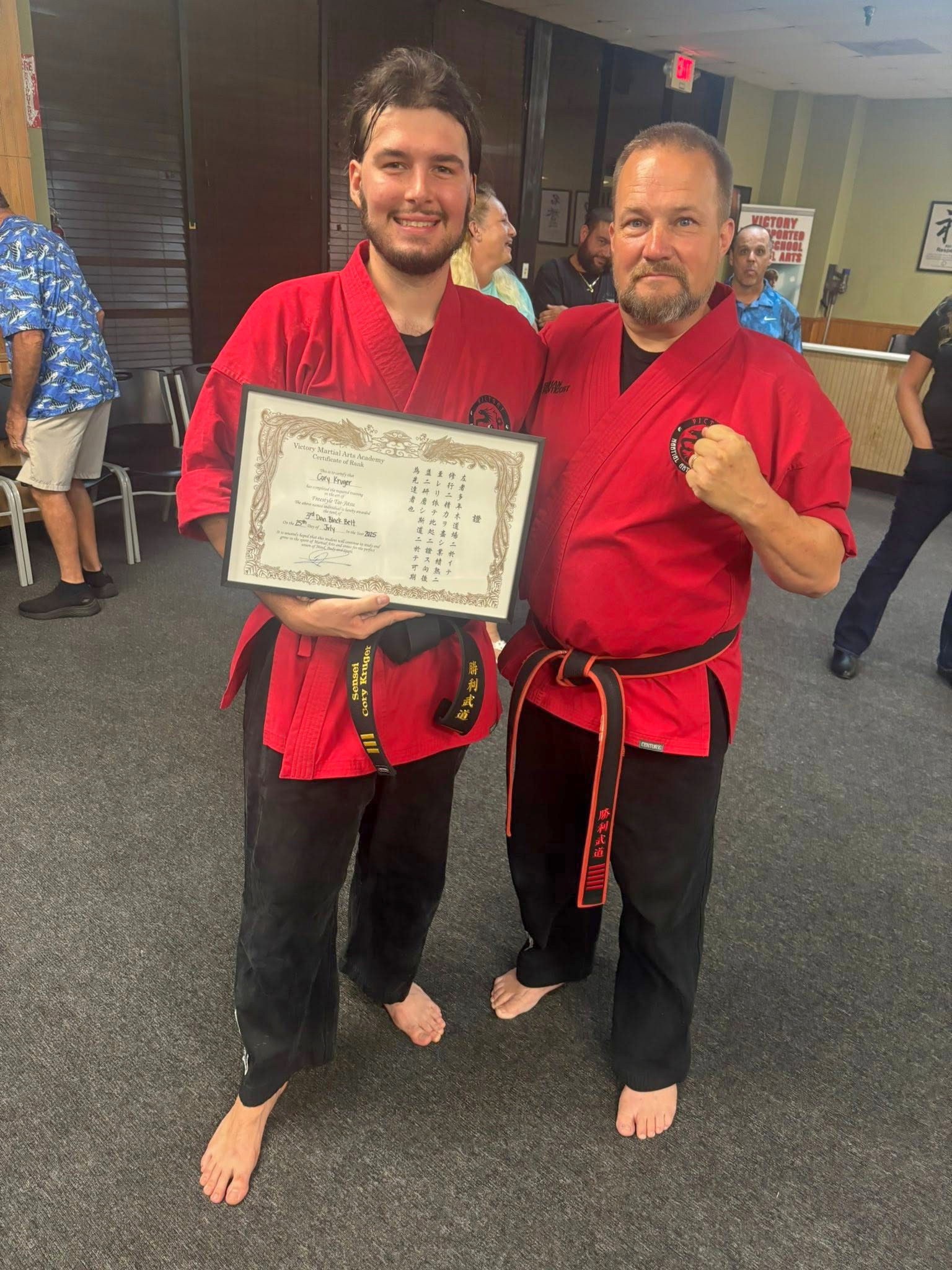 Sensei Cory celebrates his third degree black belt achievement with Kyoshi Phil.