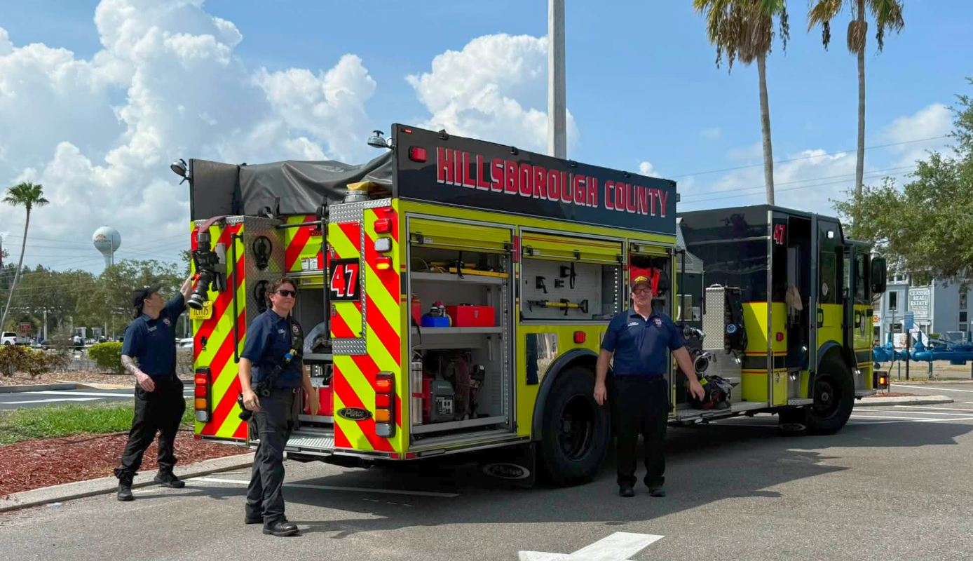 A moment with firefighters and their firetruck during a camp outing.
