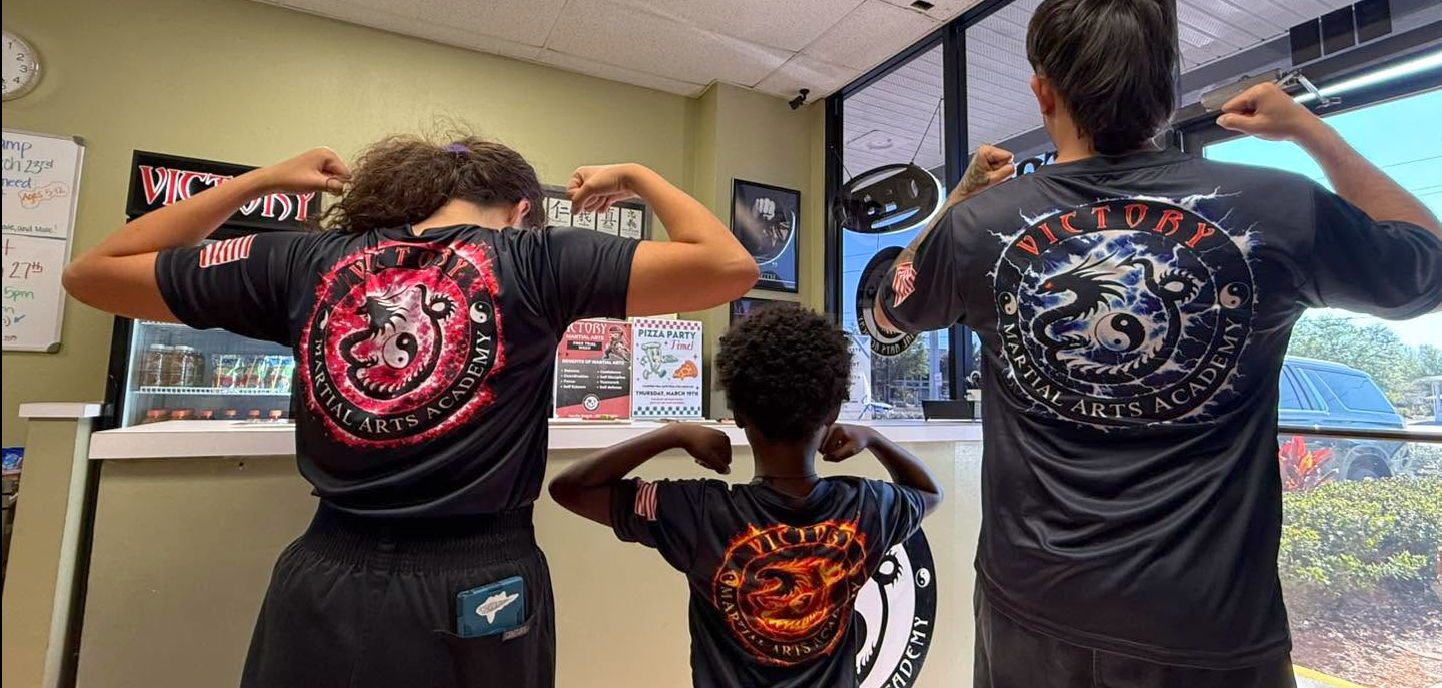 Students and instructors show off their Victory training gear.