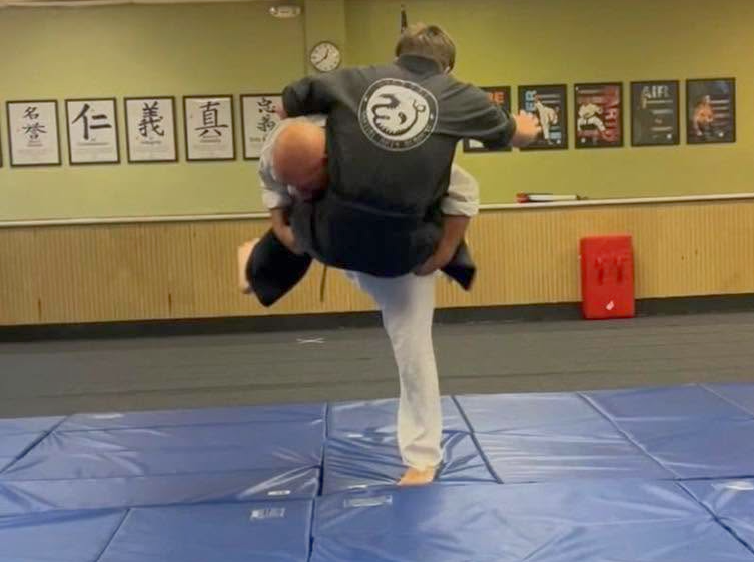 Martial arts training includes practice in takedown techniques.