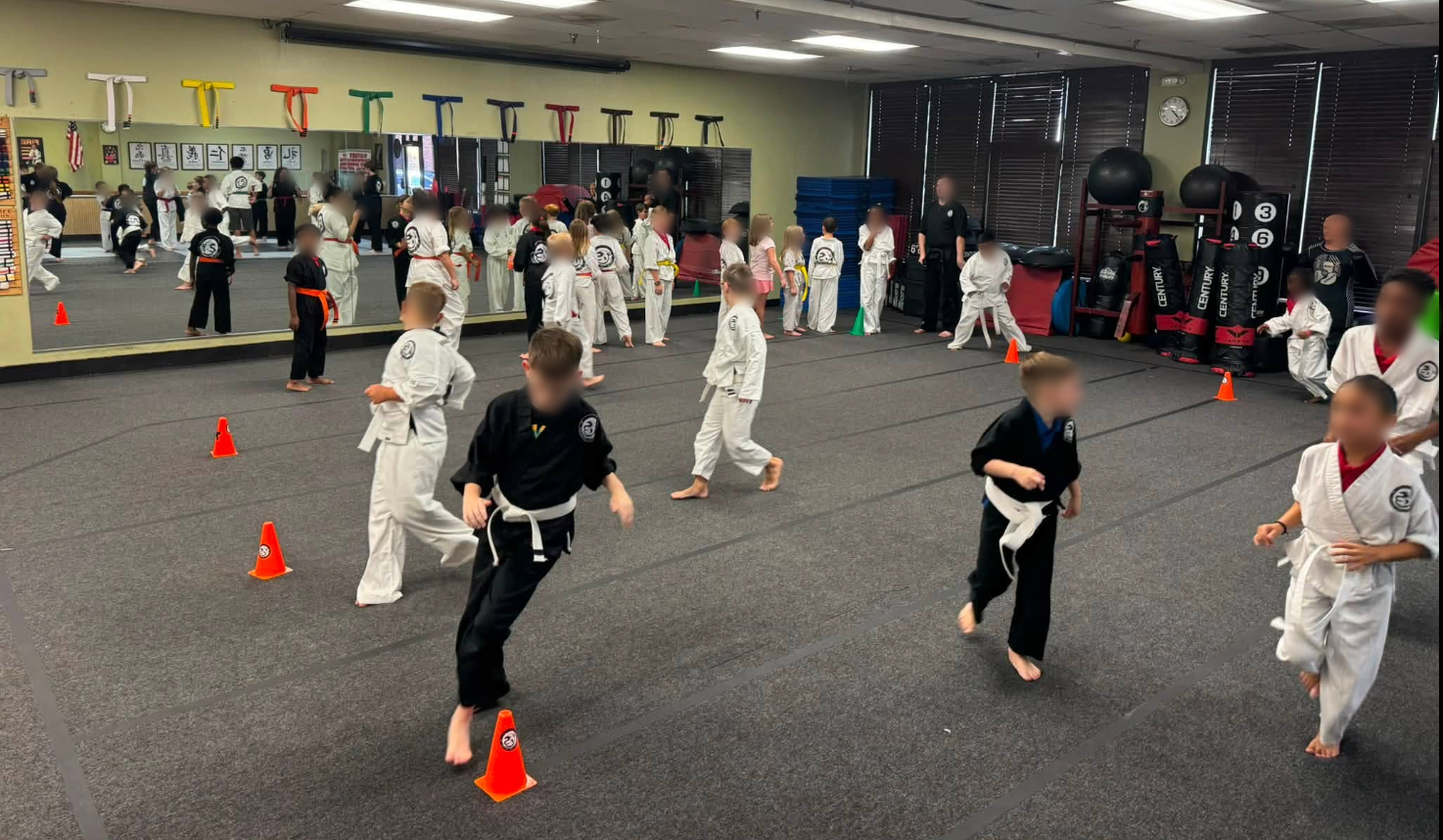 Students work on movement during martial arts class.