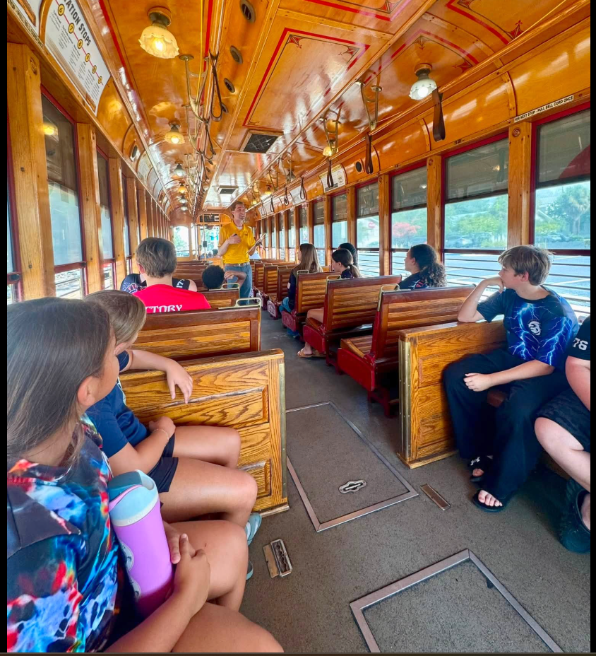 Campers enjoy a ride together during a summer outing.