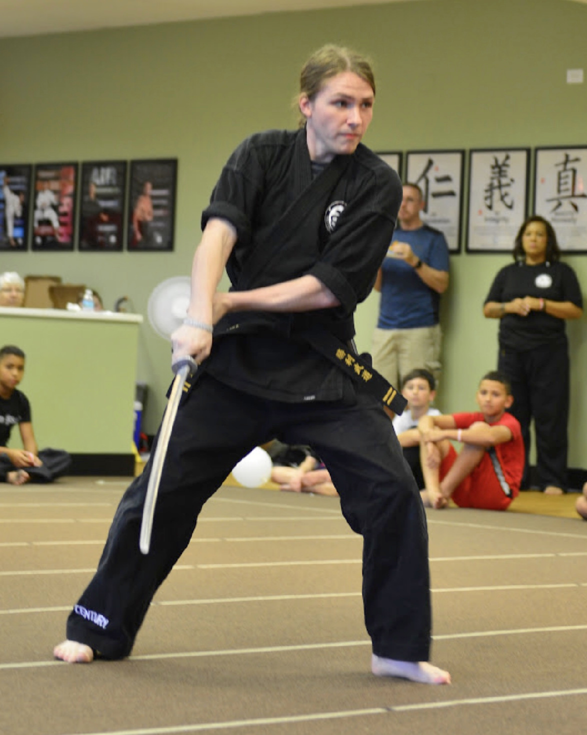 A martial artist demonstrates sword technique.