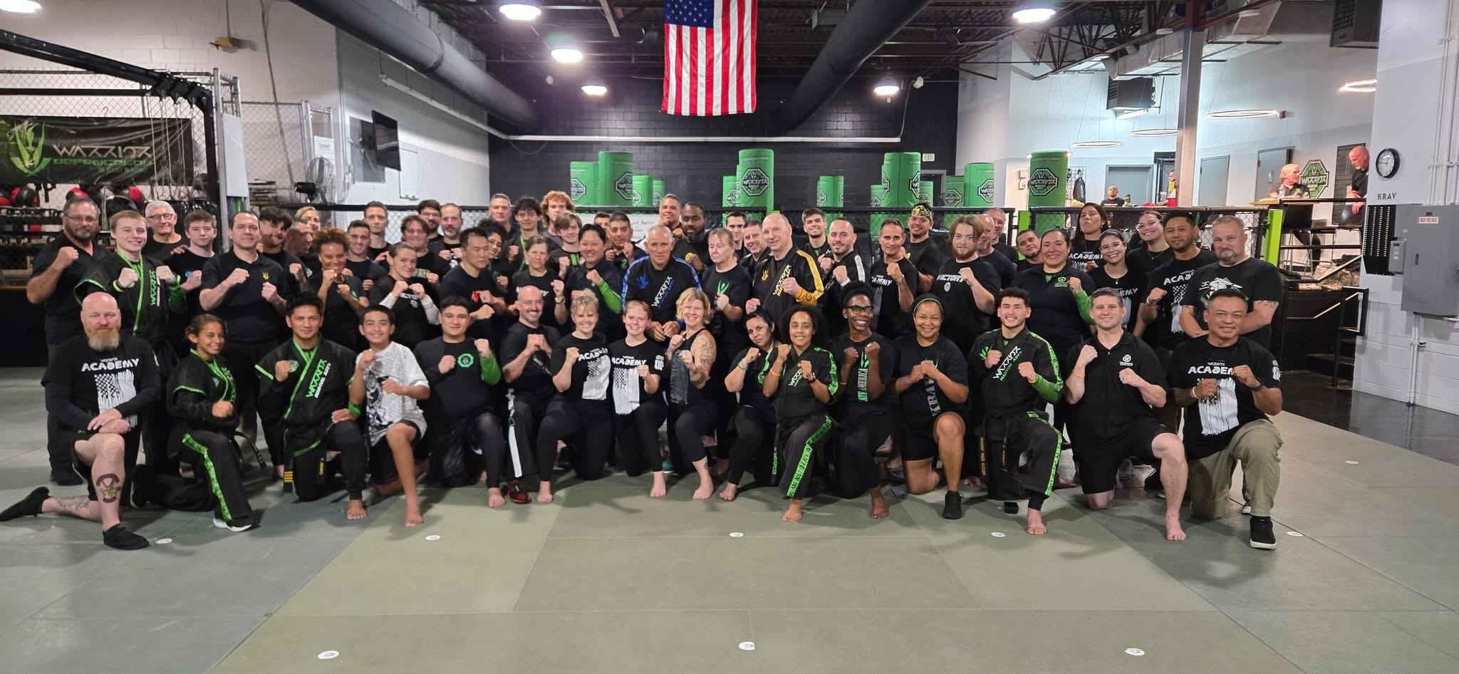 Martial artists gather for a group photograph after training.