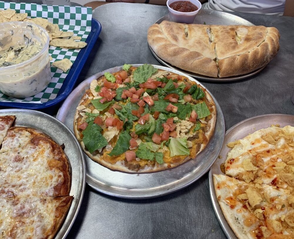 Abe's Place interior image showing pizza boxes and the drink machine.