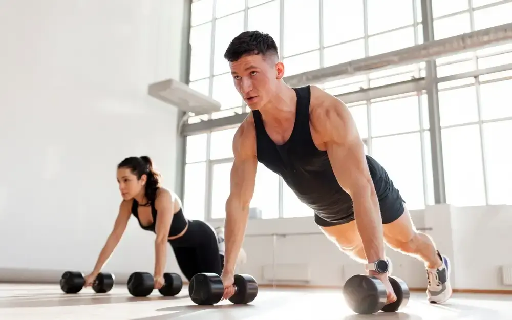woman sitting on windowsill looking out