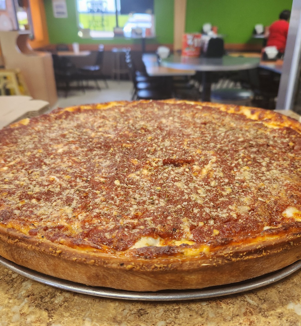 A deep-dish "Chi-Pie" pizza, loaded with cheese and sauce.