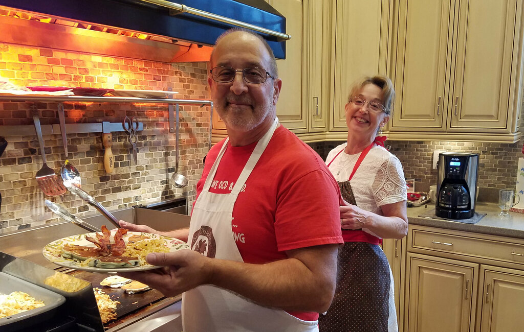 Karen and John cooking breakfast