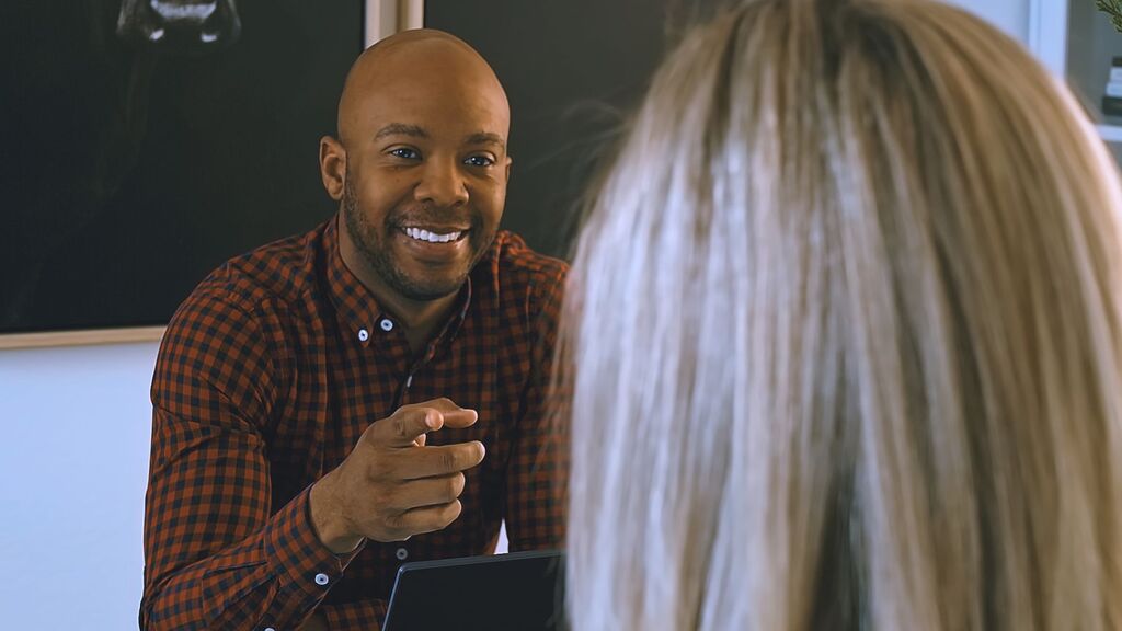 Discovery & Insight image: “Consultation session reviewing brand values, audience insights and emotional tone.”