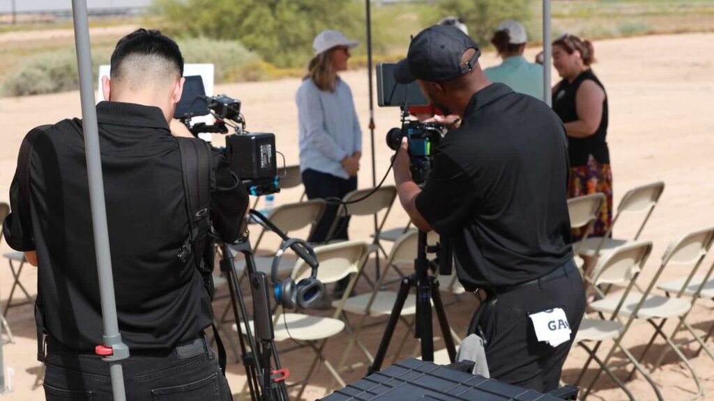 “True Narrative Media crew preparing camera setup before brand shoot.”
