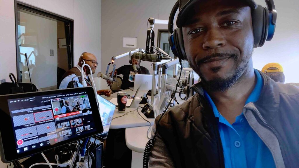 "Team member in studio recording EZ Sports Talk Show"