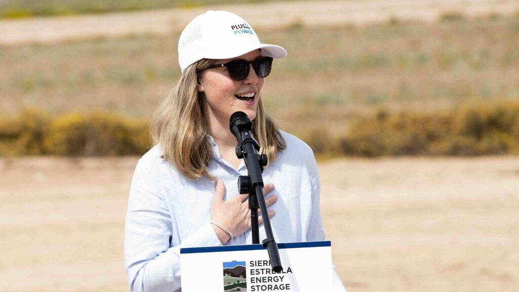 "Speaker addressing attendees during Plus Power energy project ceremony."