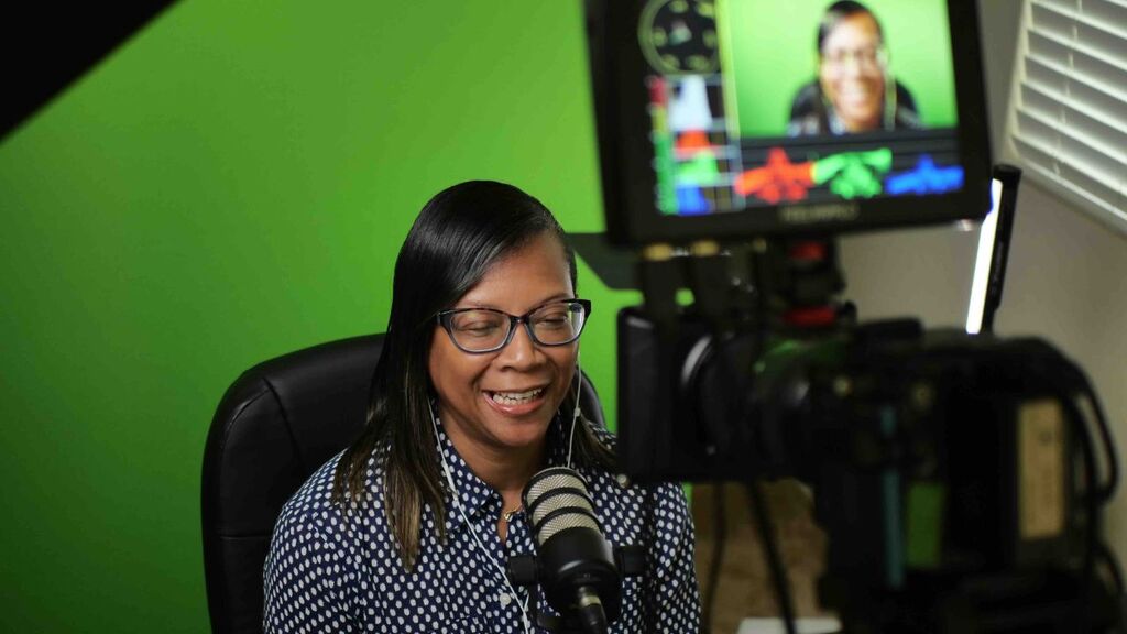 “Michelle Hayward recording an episode of ‘The Real About Real Estate’ podcast.”