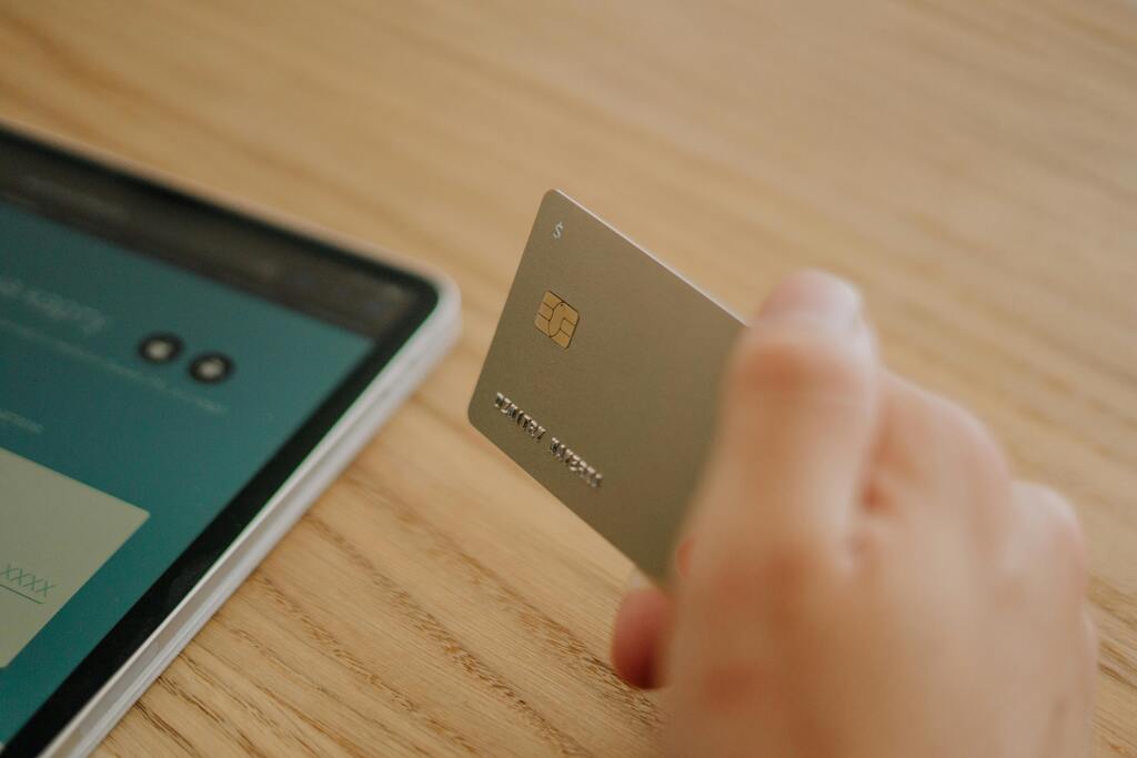 A picture of someone holding a credit card