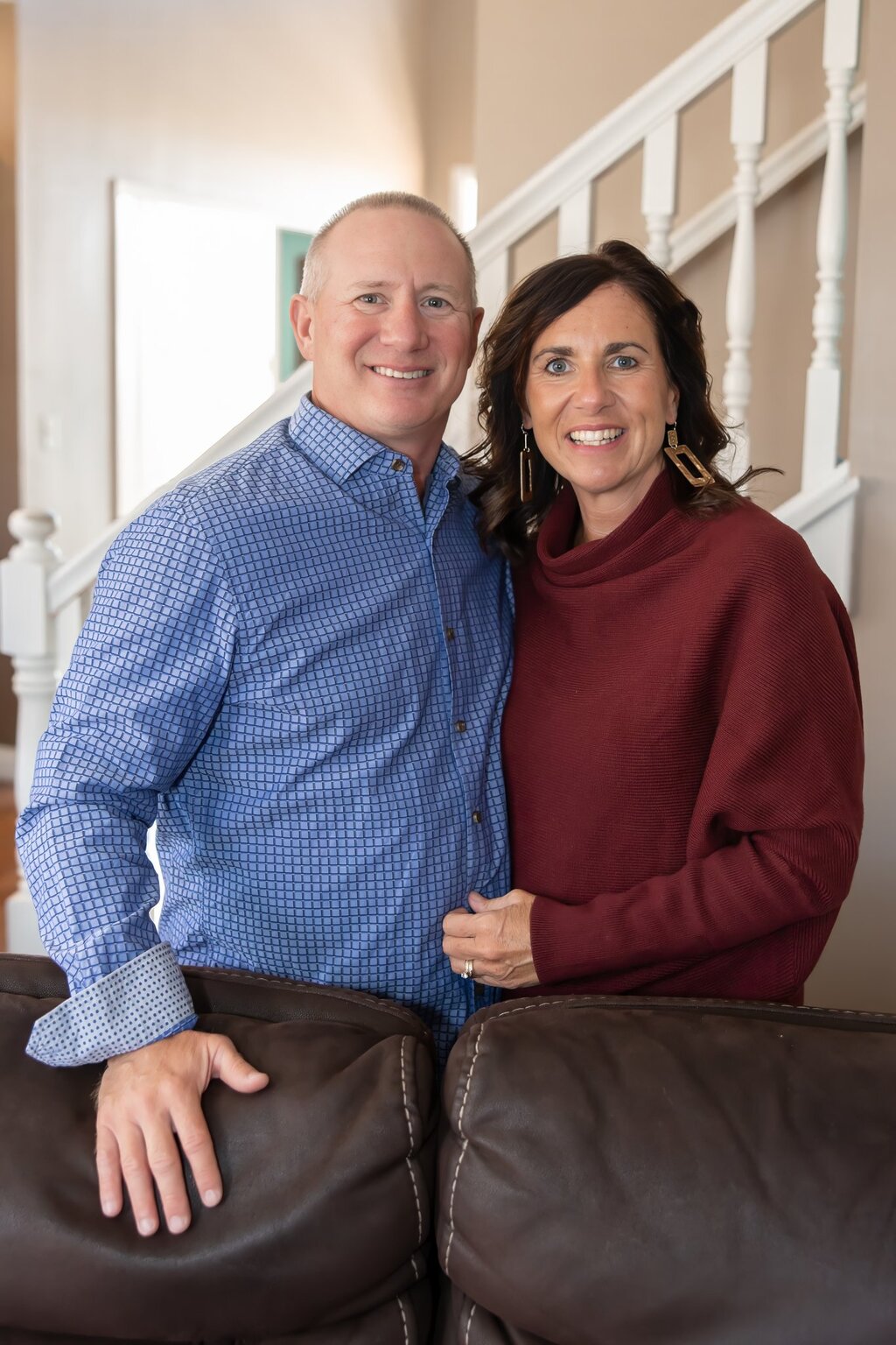 Kirby and Paula Kirkpatrick standing together in their home.