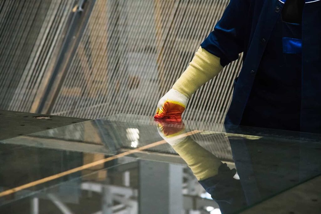 JM Glass worker handling glass