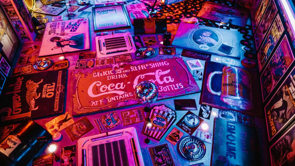 Colorful retro signs and vintage Americana decor under vibrant lighting