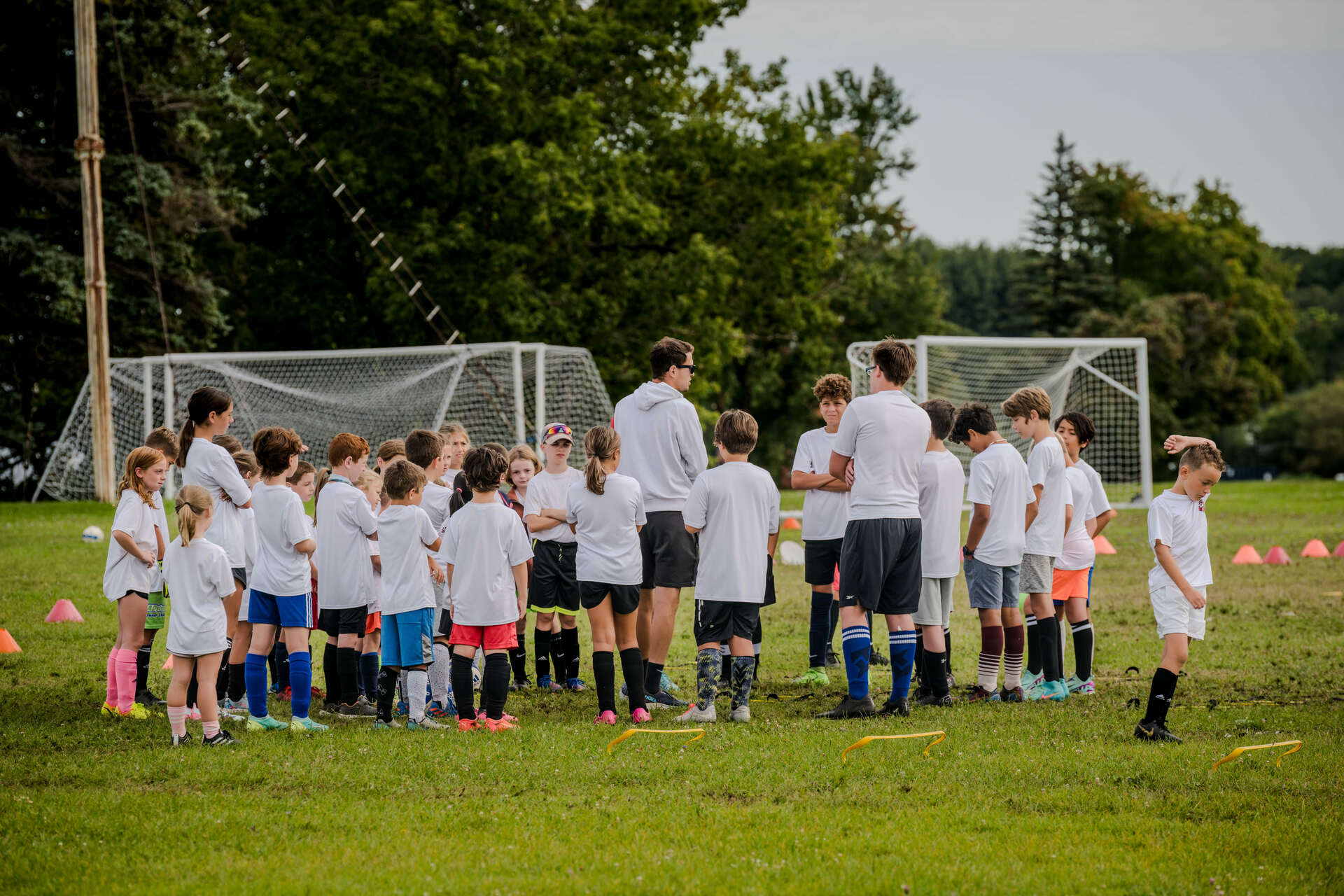 Soccer player Bogdan Milvanovic holding a trophy for a National Champion won with BSSCollege in Syracuse