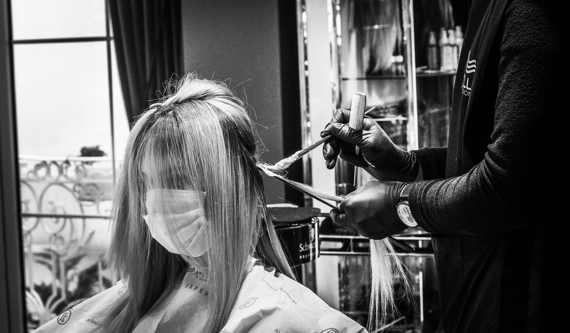 grayscale-photo-of-a-woman-in-salon