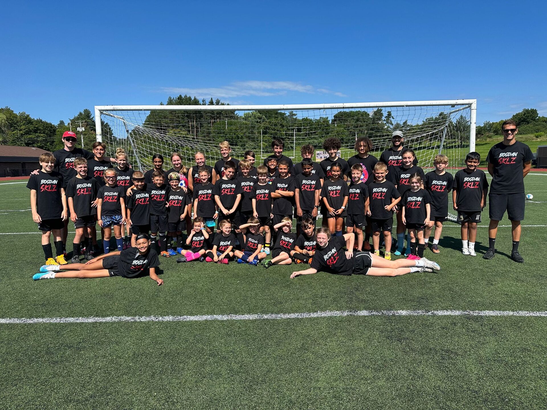 Soccer player Bogdan Milvanovic holding a trophy for a National Champion won with BSSCollege in Syracuse