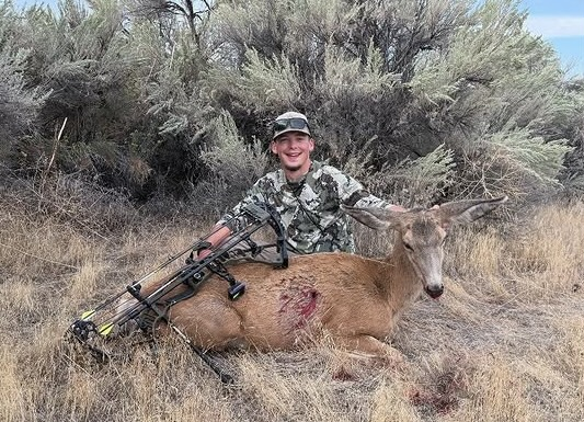 Carson with a deer