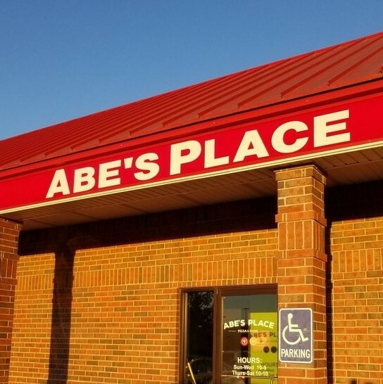 Abe's Place exterior in golden light from the sunset.