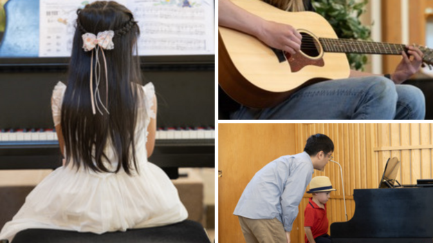 Boy playing a guitar with a music instructor