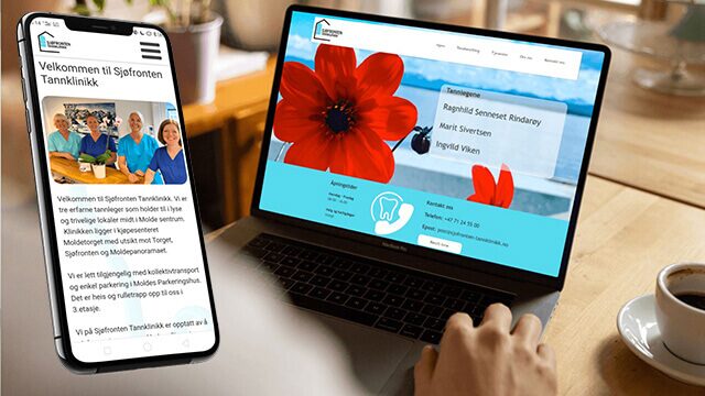 Pc på et bodr og en mobil som begge har Sjøfronten Tannklinikk på skjermene