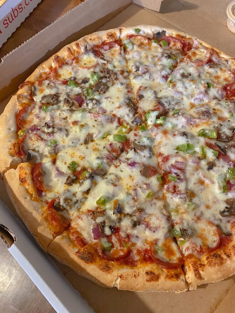 Abe's Place exterior in golden light from the sunset.