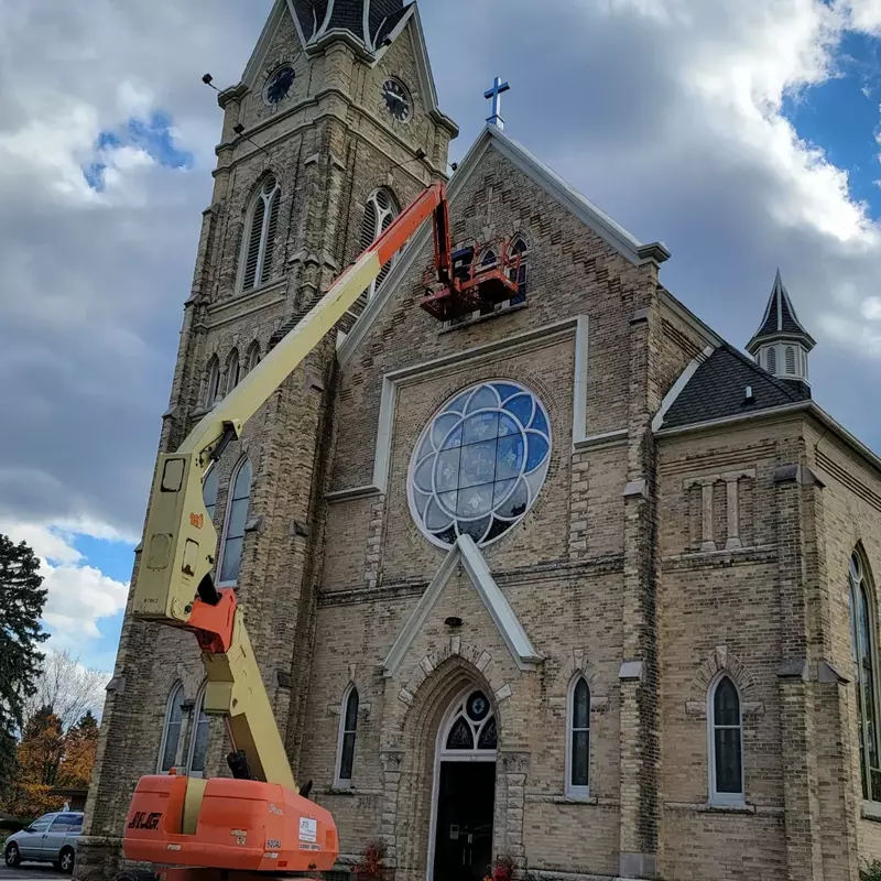 Repairing Church window glass.