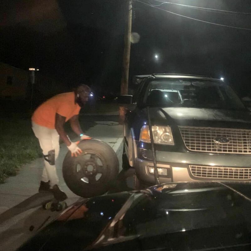 AMMO performing tire replacement service on suv