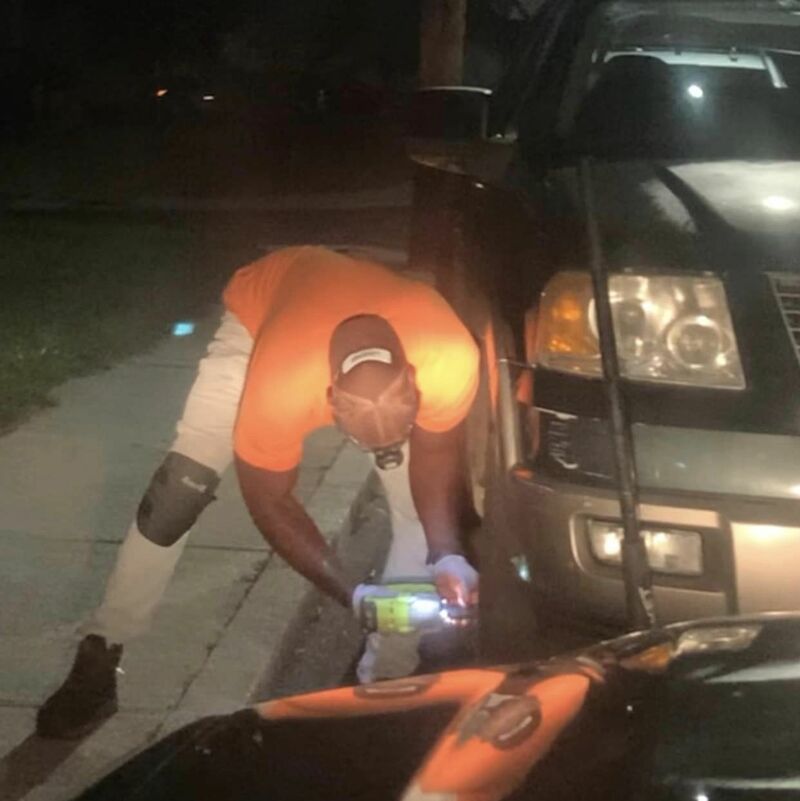 AMMO performing tire replacement service on suv