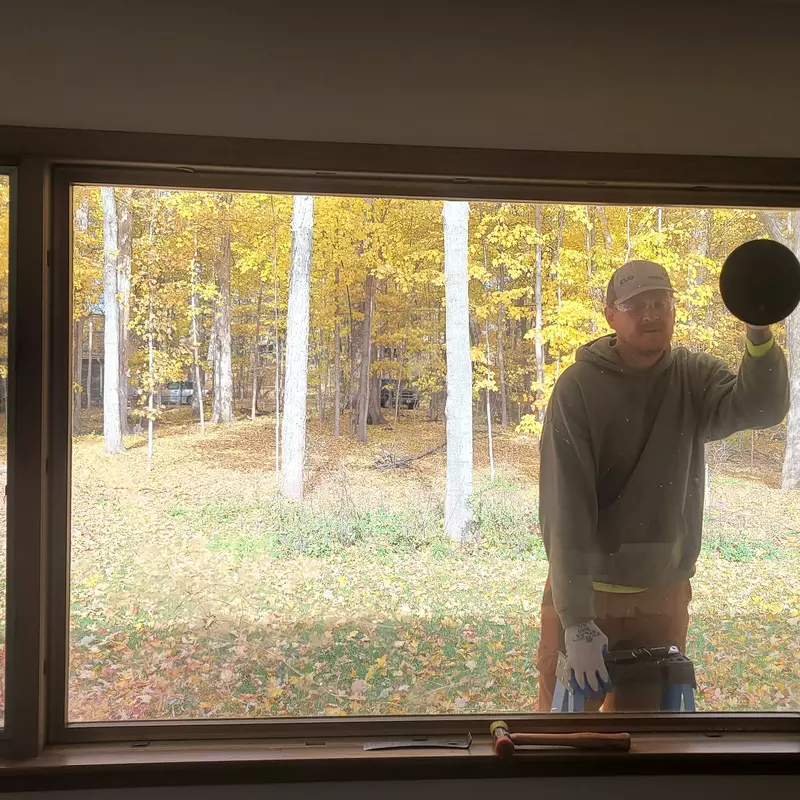 Paul installing large pane.