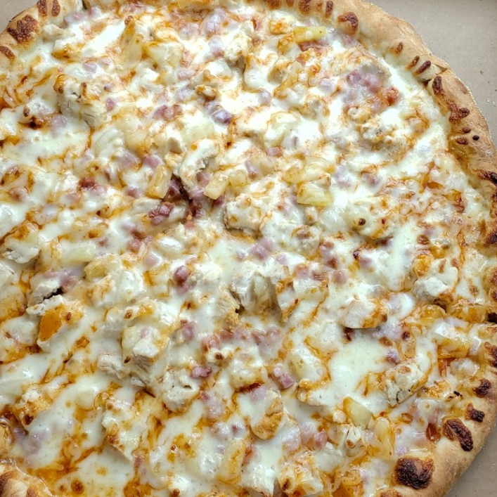Buffalo chicken pizza served on traditional crust