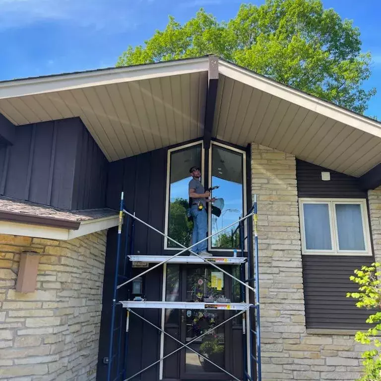Repairing old angled clerestory windows.