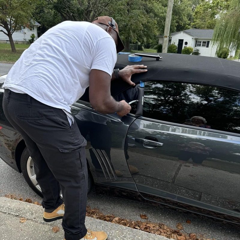 AMMO performing lockout service on dark gray car