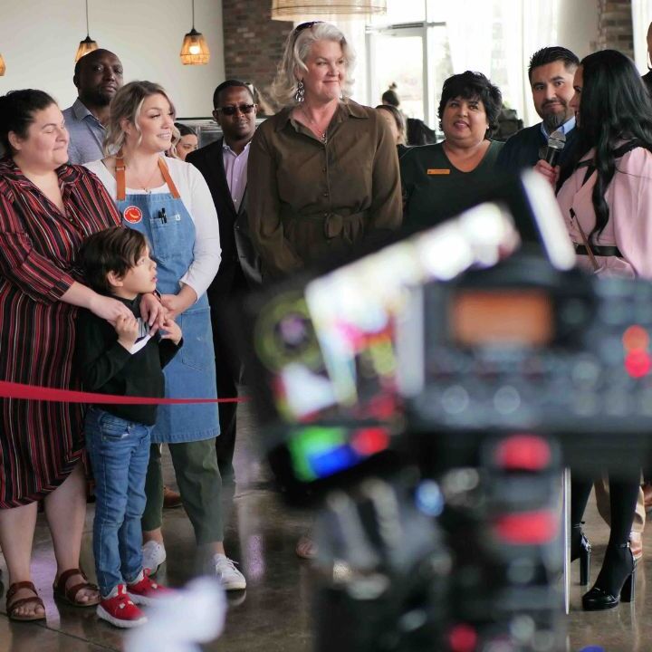 “Ribbon‑cutting ceremony at a local business with chamber officials.”