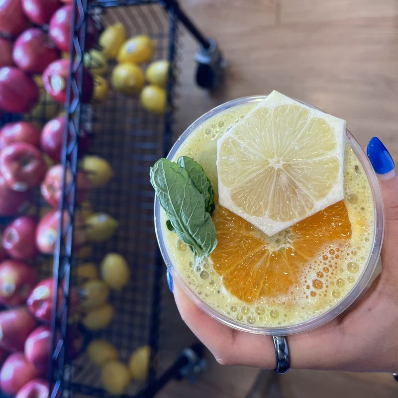 A fresh juice with lemon, basi and orange