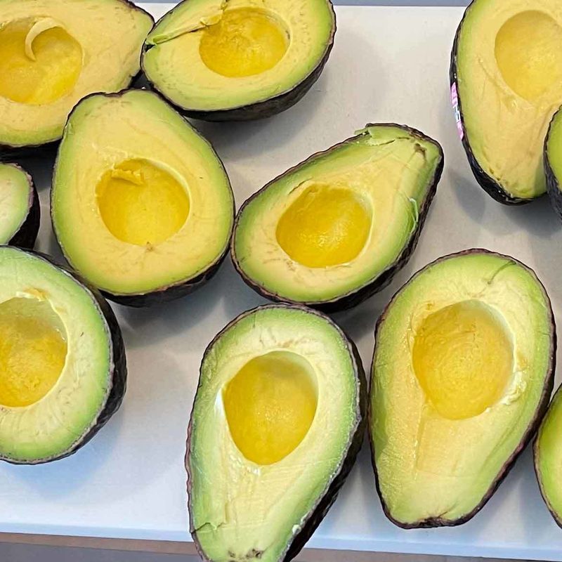 12 fresh avocado halves wait to be added to our juices, bowls, smoothies and more!